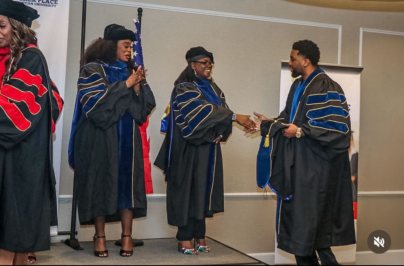 Dr. Joshua Randall at his doctoral hooding ceremony